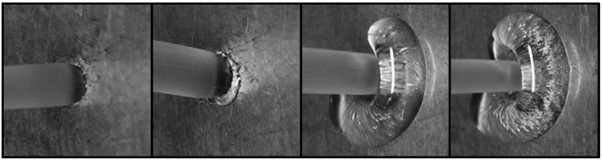 Material accumulation and deposition at the die exit